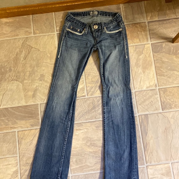 Daytrip Denim - Low cut, boot cut jeans.  Small wear in pocket.  Shown in pictures